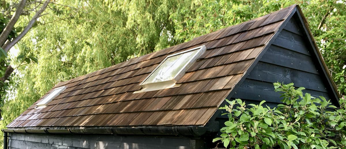 cedar-shingle-roof-woodshed-freshly-stained.jpg